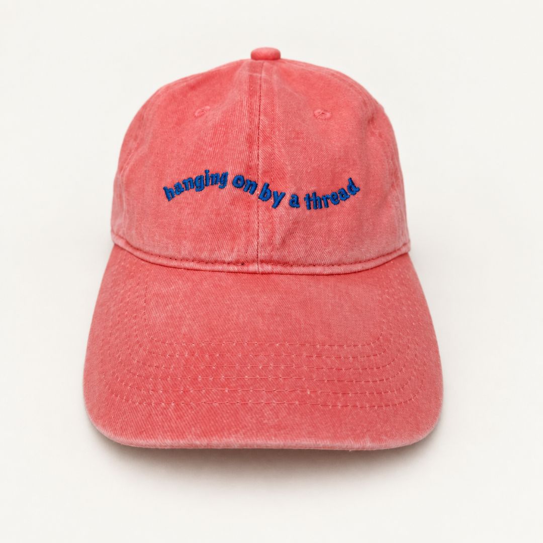 Hanging On By A Thread Cap